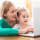 mother and daughter doing online speech therapy