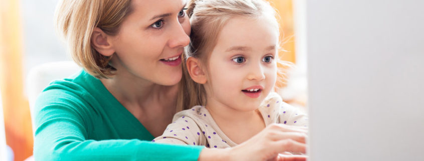 mother and daughter doing online speech therapy