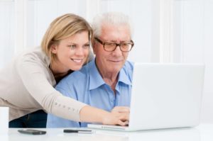 online parkinsons speech therapy for a man at his computer