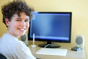 Child doing online speech therapy as opposed to in person