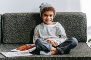 child sitting on a couch