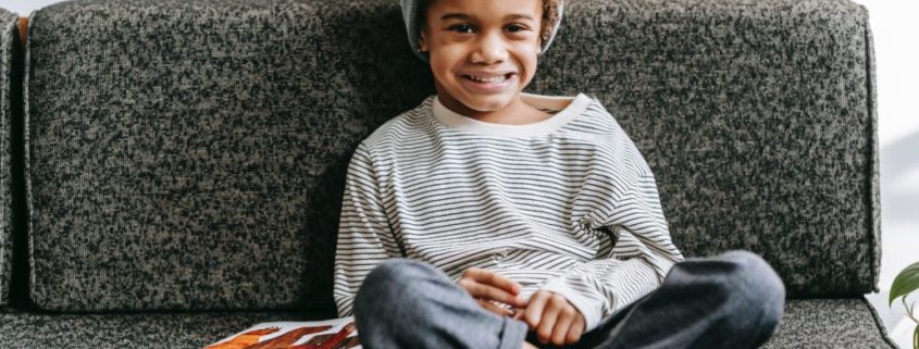 child sitting on a couch