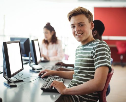 a young man on his school computer