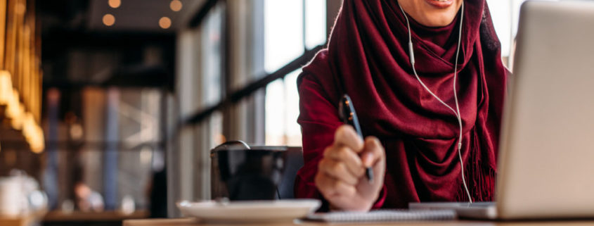 a woman taking an online class to reduce her accent