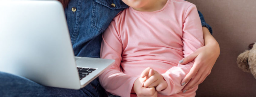 a child at home working on her communication skills through online learning