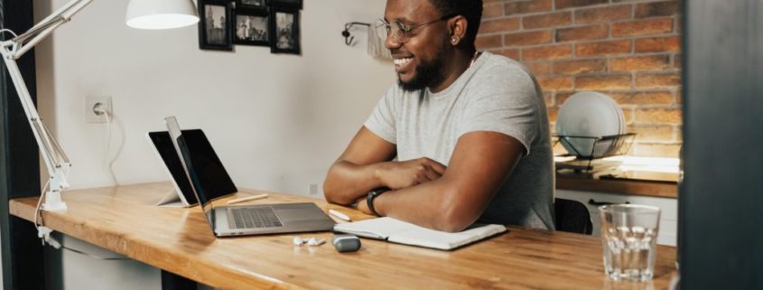 a man at home with ADHD doing online speech therapy