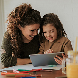 mom and daughter looking on laptop representing Launch Your Specialized Program