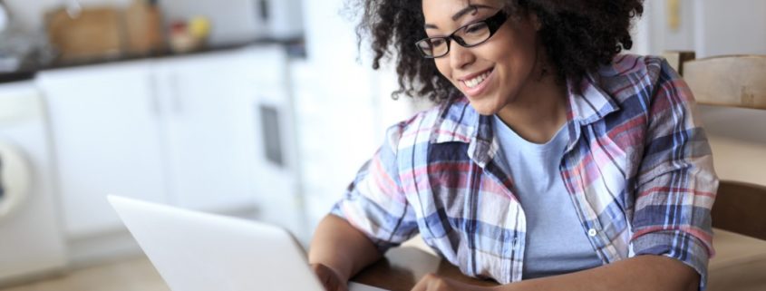 woman at home on her laptop researching