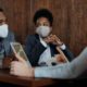 a couple with masks on learning about vocal hygiene