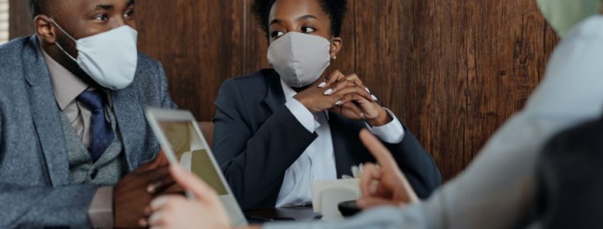 a couple with masks on learning about vocal hygiene