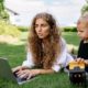 woman and child researching Einstein syndrome outside on a laptop