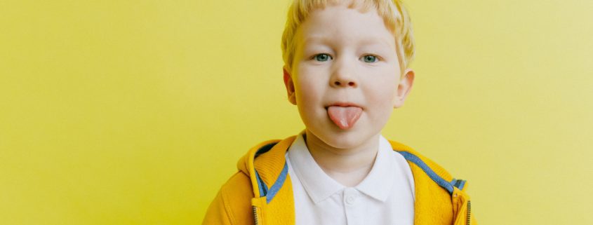 a child exercising their tongue to improve their speech