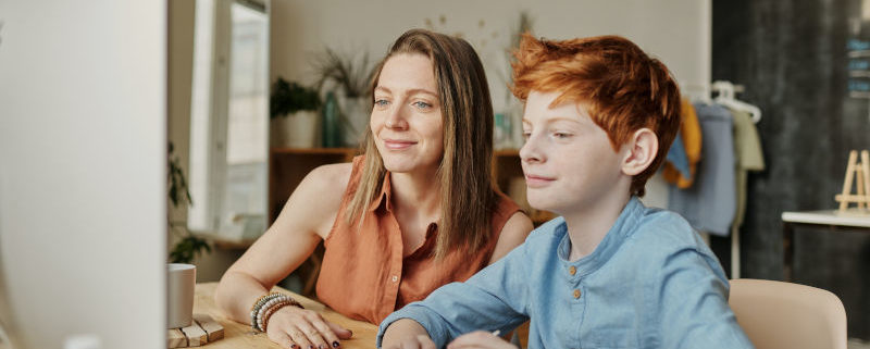 A child at home working on his stutter with an online speech therapist