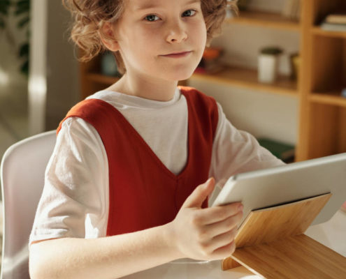 a child at home doing speech therapy exercises online