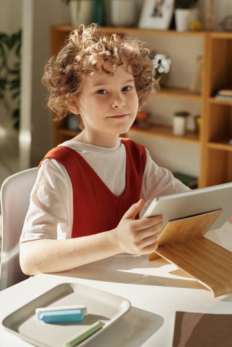 a child at home doing speech therapy exercises online