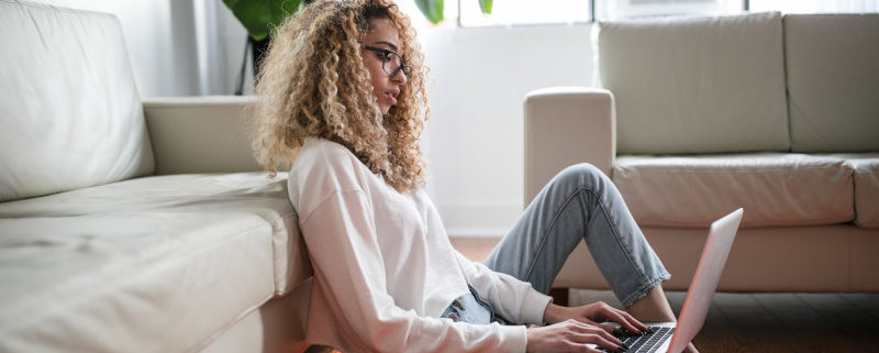 a woman at home on her laptop suffering anxiety