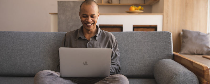 man learning from his laptop at home