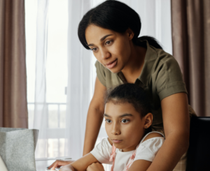 mother and child and home doing online speech therapy
