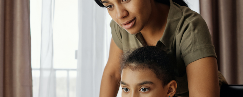 mother and child and home doing online speech therapy