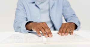 closeup of a persons hands on a white table