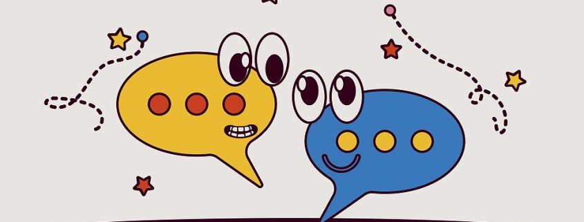 cartoon icon representing two speech bubbles chatting
