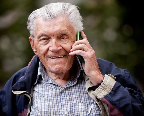an elderly man on his cell phone