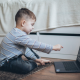 child using his laptop at home to help improve his speech